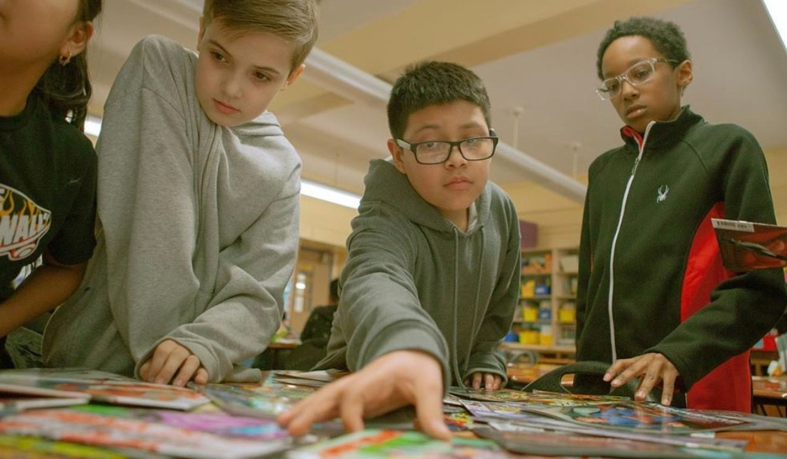 students select reading material in the library